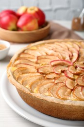 Tasty apple pie on white table, closeup