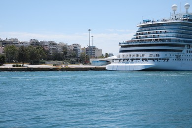 Photo of Modern cruise ship in sea on sunny day