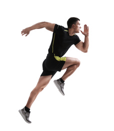 Photo of Athletic young man running on white background, side view