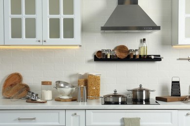 Countertop with different cooking utensils in kitchen