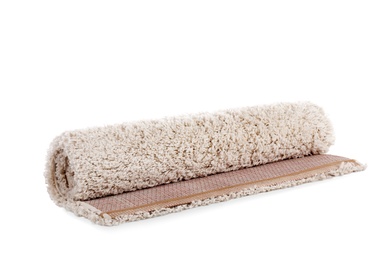 Rolled fuzzy carpet on white background. Interior element