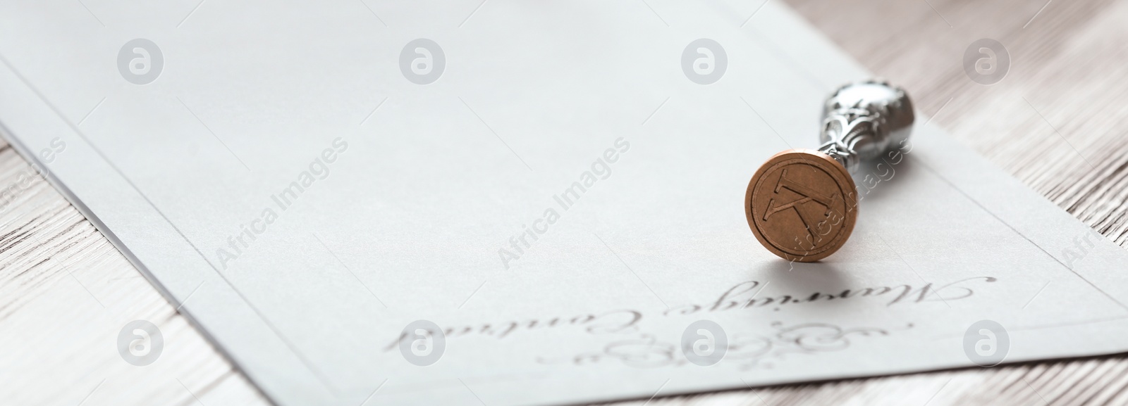 Image of Vintage notary stamp and document on wooden table, space for text. Banner design