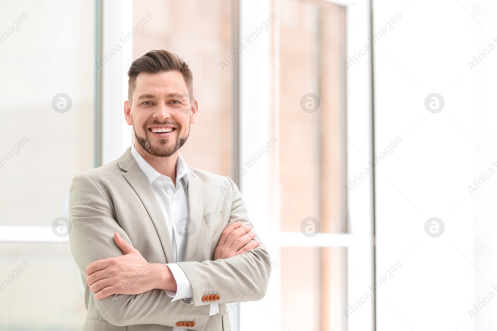 Photo of Young man in office wear on blurred background