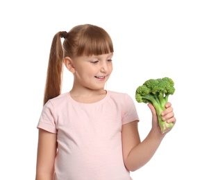 Photo of Portrait of cute little girl with broccoli on white background
