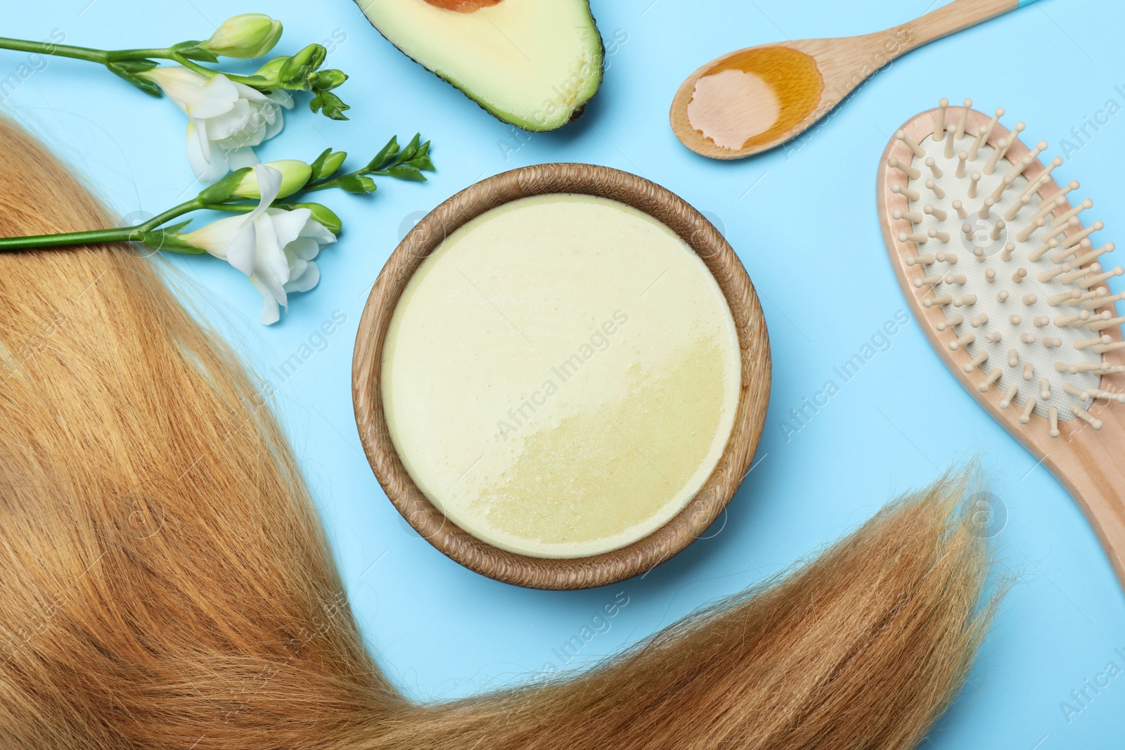 Photo of Flat lay composition with homemade hair mask and ingredients on light blue background