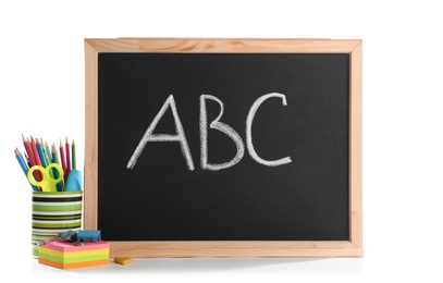 Photo of Small chalkboard and different school stationery on white background