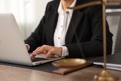 Photo of Notary using laptop at workplace in office, closeup