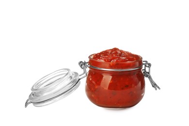 Delicious adjika sauce in glass jar isolated on white