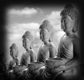 Image of Row of stone Buddha sculptures outdoors. World religion