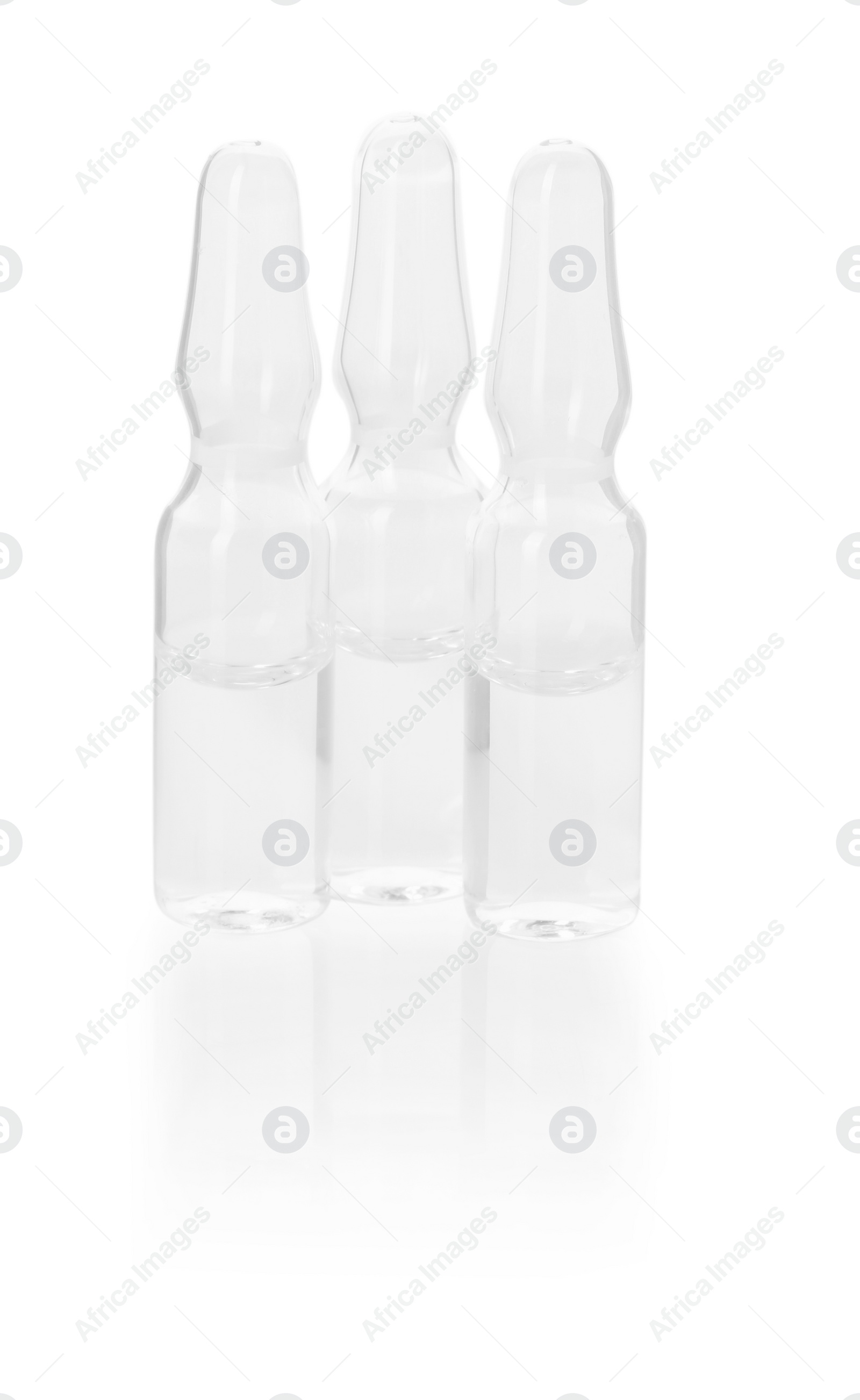 Photo of Glass ampoules with liquid isolated on white