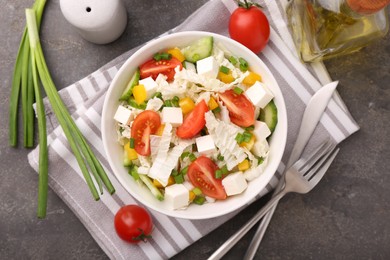 Photo of Tasty salad with Chinese cabbage served on grey table, top view