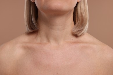 Photo of Woman with healthy skin on beige background, closeup