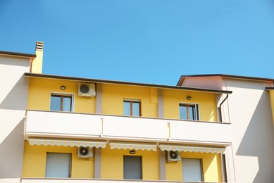 Beautiful house with large balcony against blue sky