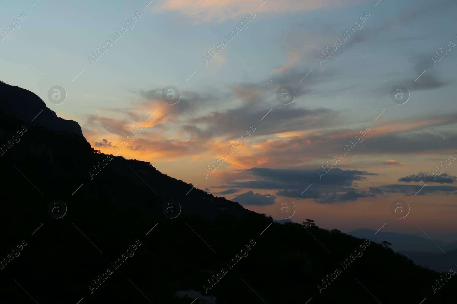 Photo of Picturesque view of big hill at beautiful sunset