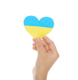 Photo of Woman holding paper heart in colors of Ukrainian flag on white background, closeup