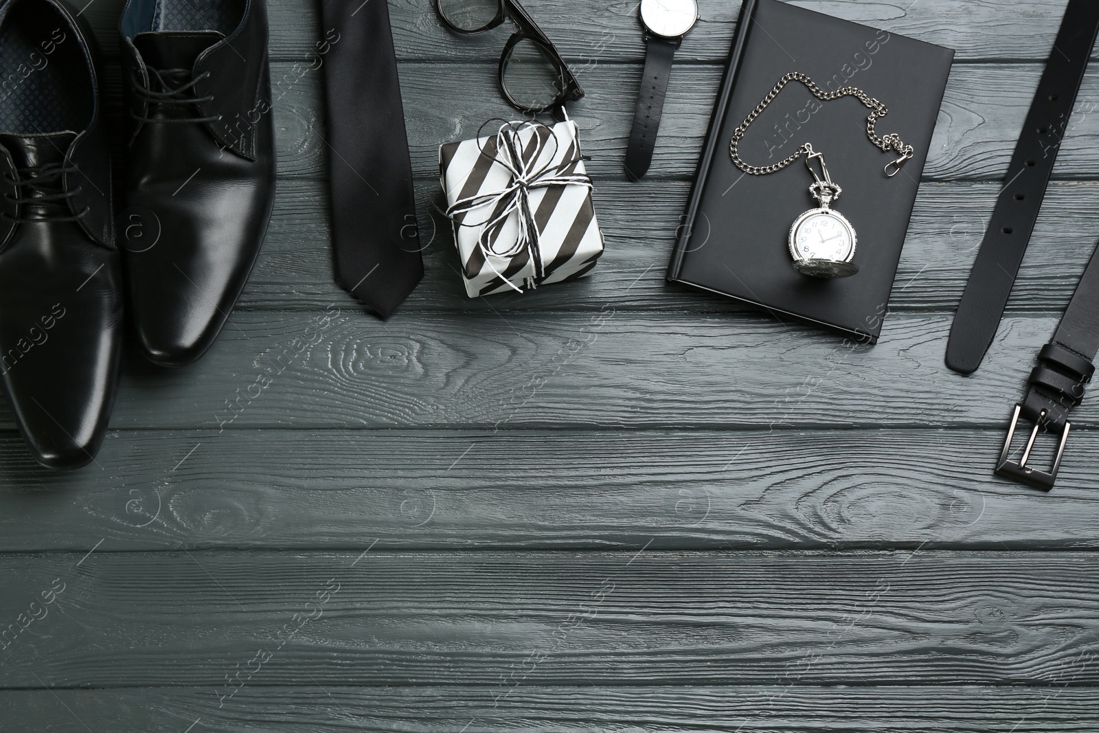 Photo of Flat lay composition with male accessories on grey wooden background, space for text. Happy Father's Day