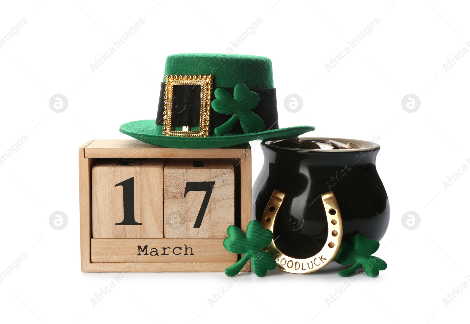 Photo of Leprechaun's hat, block calendar and St. Patrick's day decor on white background