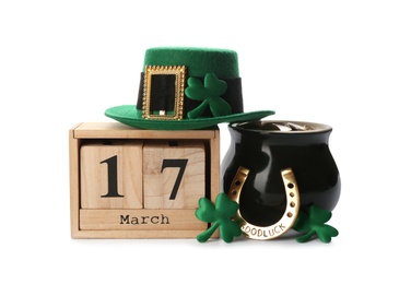 Leprechaun's hat, block calendar and St. Patrick's day decor on white background