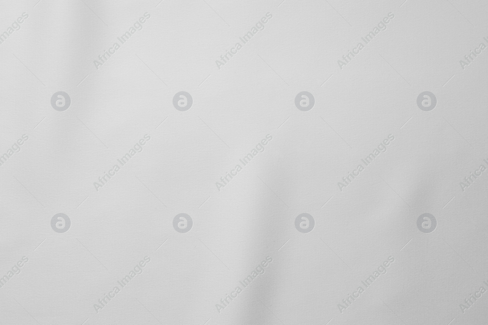 Photo of Texture of white silk fabric as background, top view