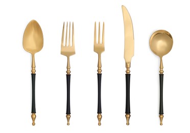 Stylish golden cutlery set on white background, top view