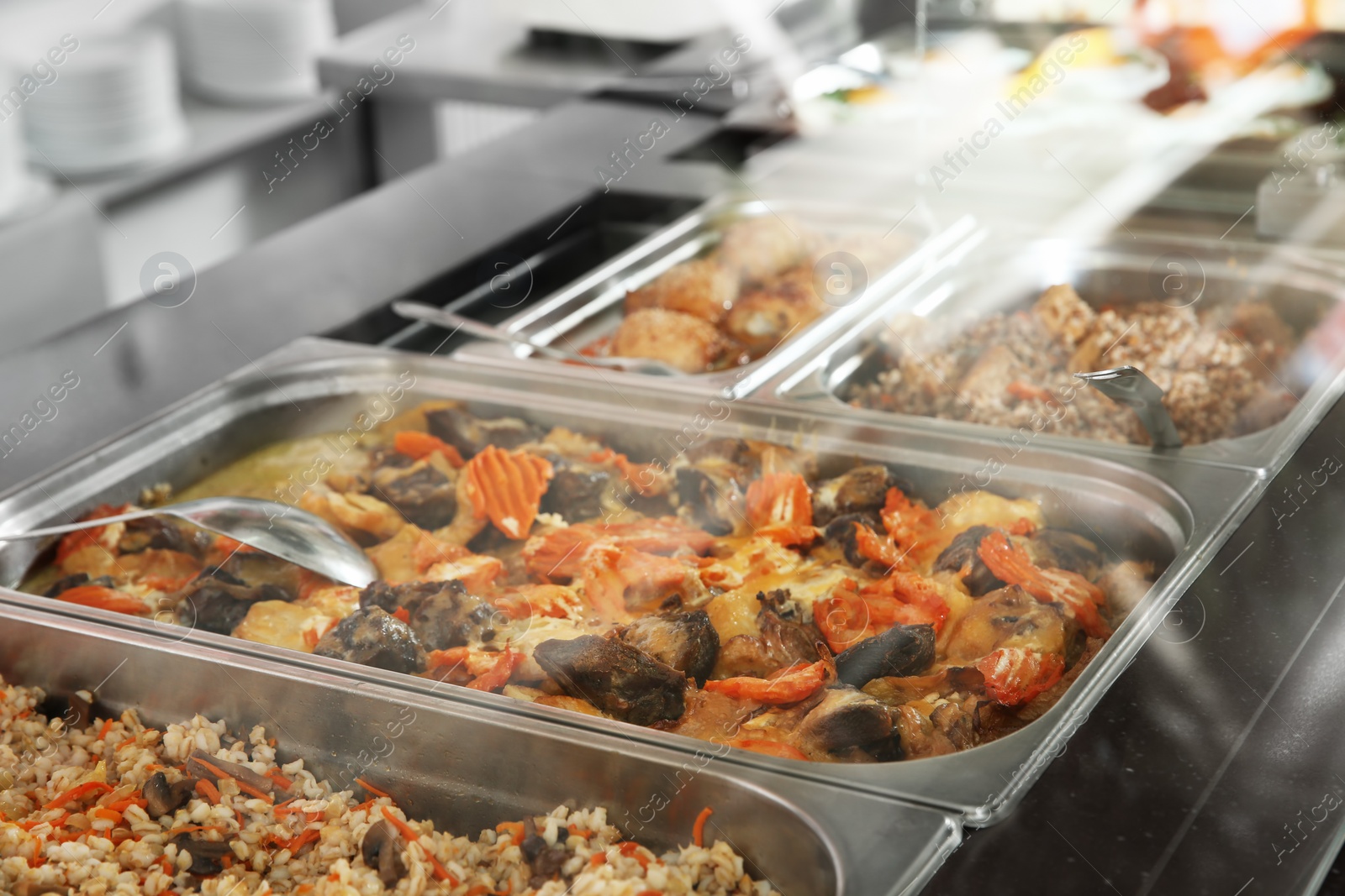 Photo of Containers with healthy food in school canteen