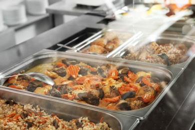 Containers with healthy food in school canteen