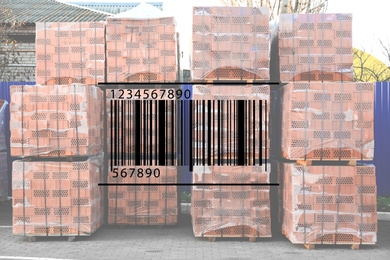 Image of Barcode and pallets with red bricks in wholesale warehouse