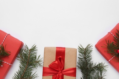 Photo of Flat lay composition with Christmas gifts on white background, space for text. Boxing day