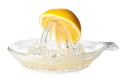 Photo of Squeezer with lemon and juice on white background