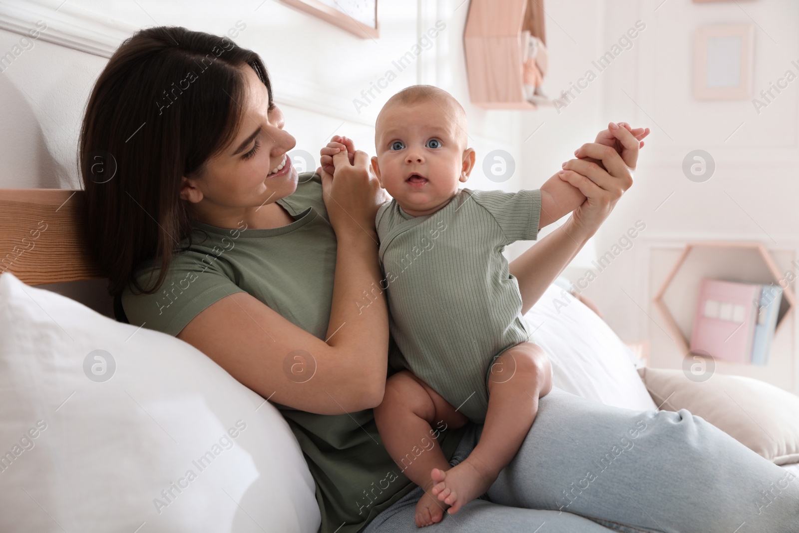 Photo of Mother with her cute baby at home