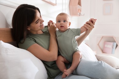 Mother with her cute baby at home