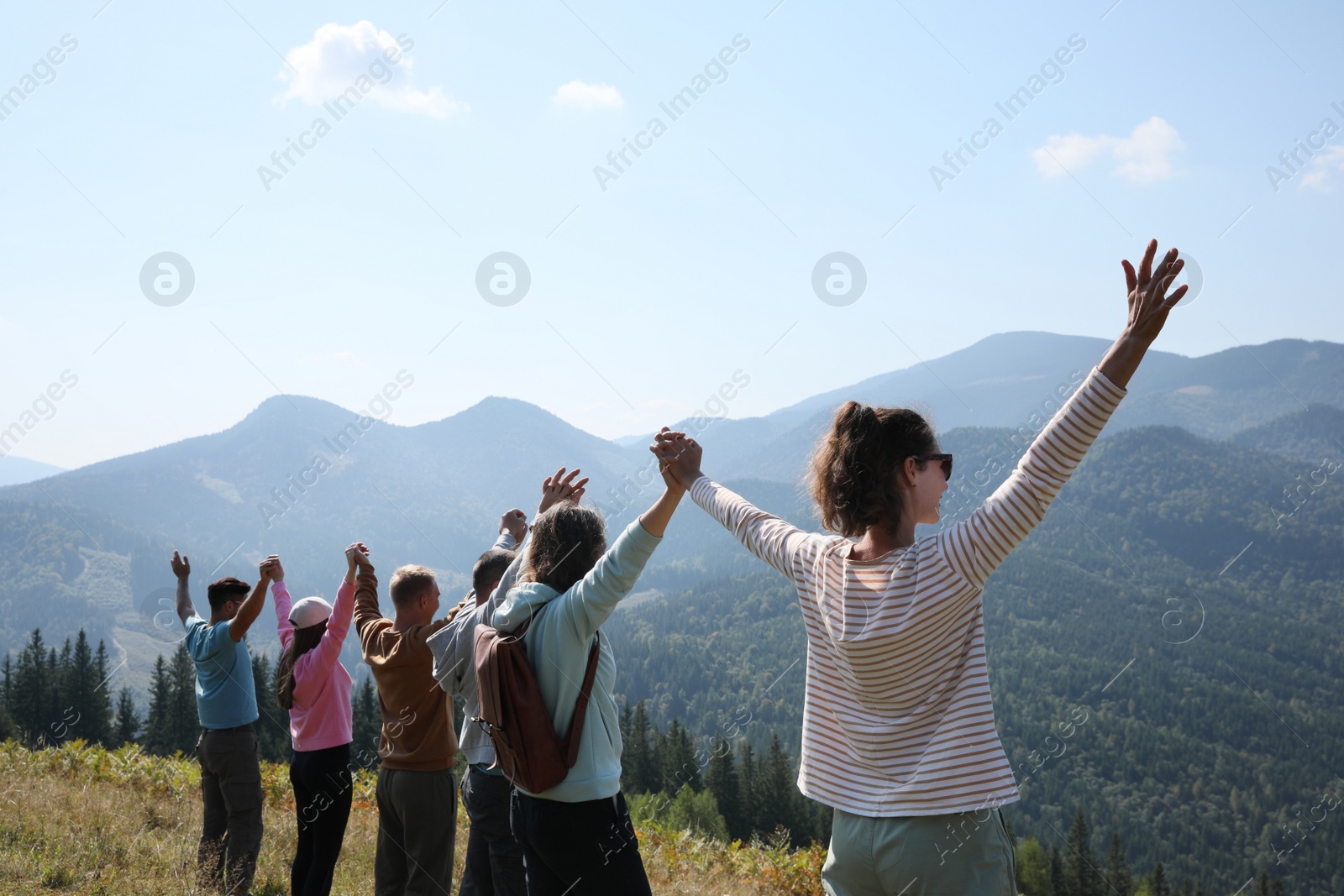 Photo of Group of people spending time together in mountains