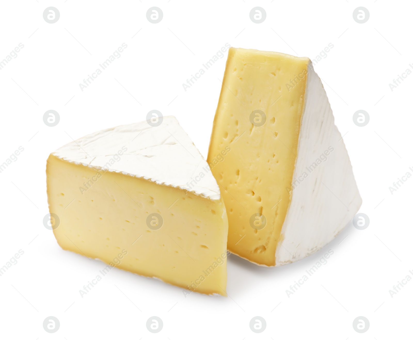 Photo of Pieces of tasty camembert cheese isolated on white