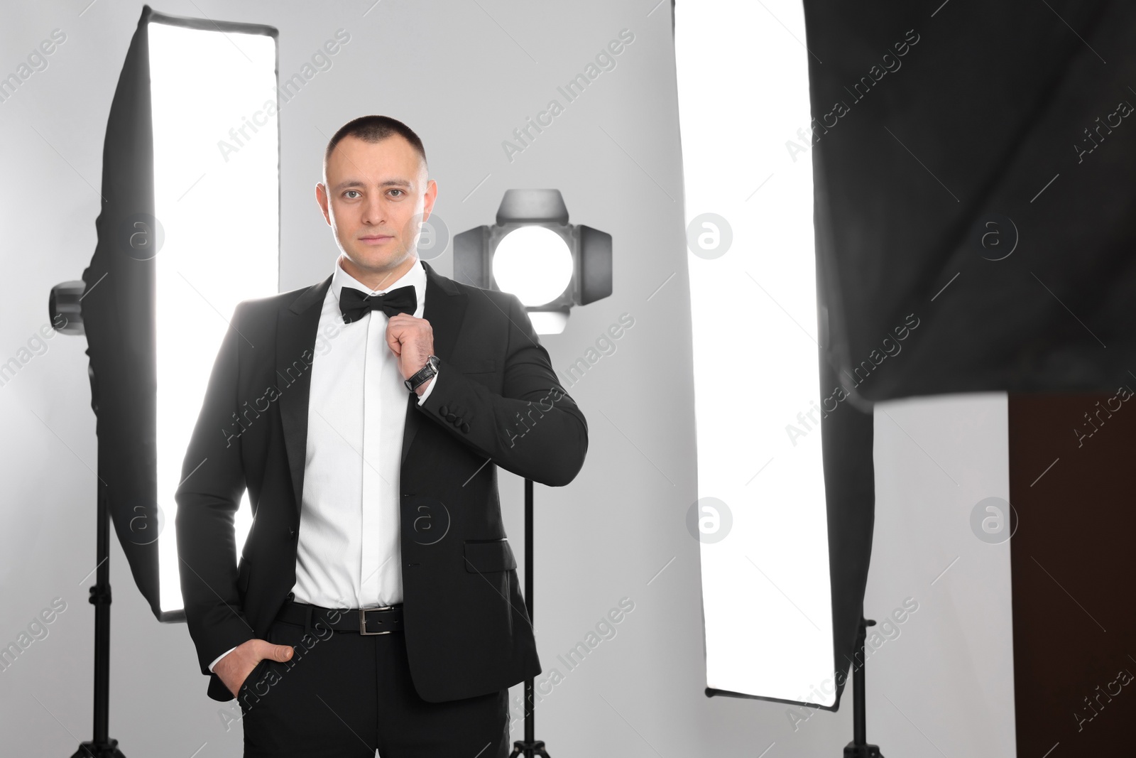 Photo of Handsome model posing in studio. Professional photo session