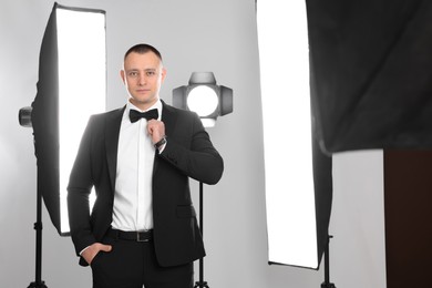Photo of Handsome model posing in studio. Professional photo session