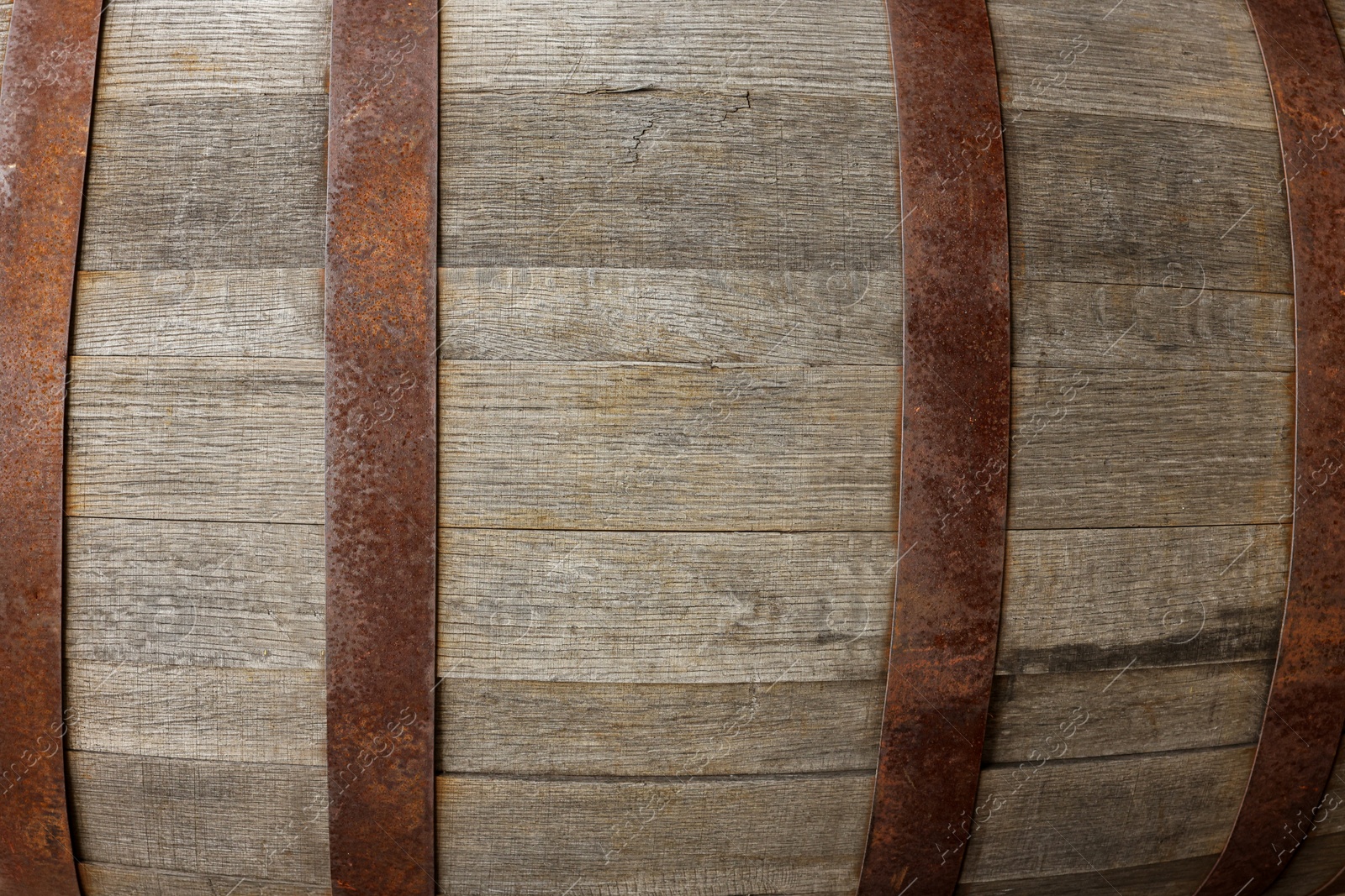 Photo of Traditional wooden barrel as background, closeup. Wine making