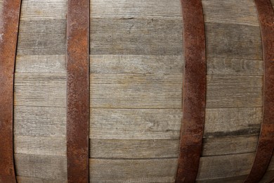 Traditional wooden barrel as background, closeup. Wine making