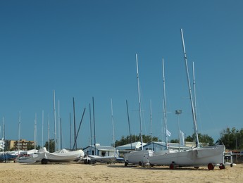 Photo of Seacoast with modern boats on sunny day