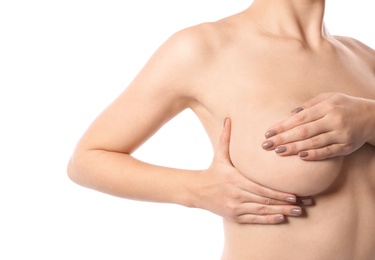 Photo of Woman checking her breast on white background, closeup