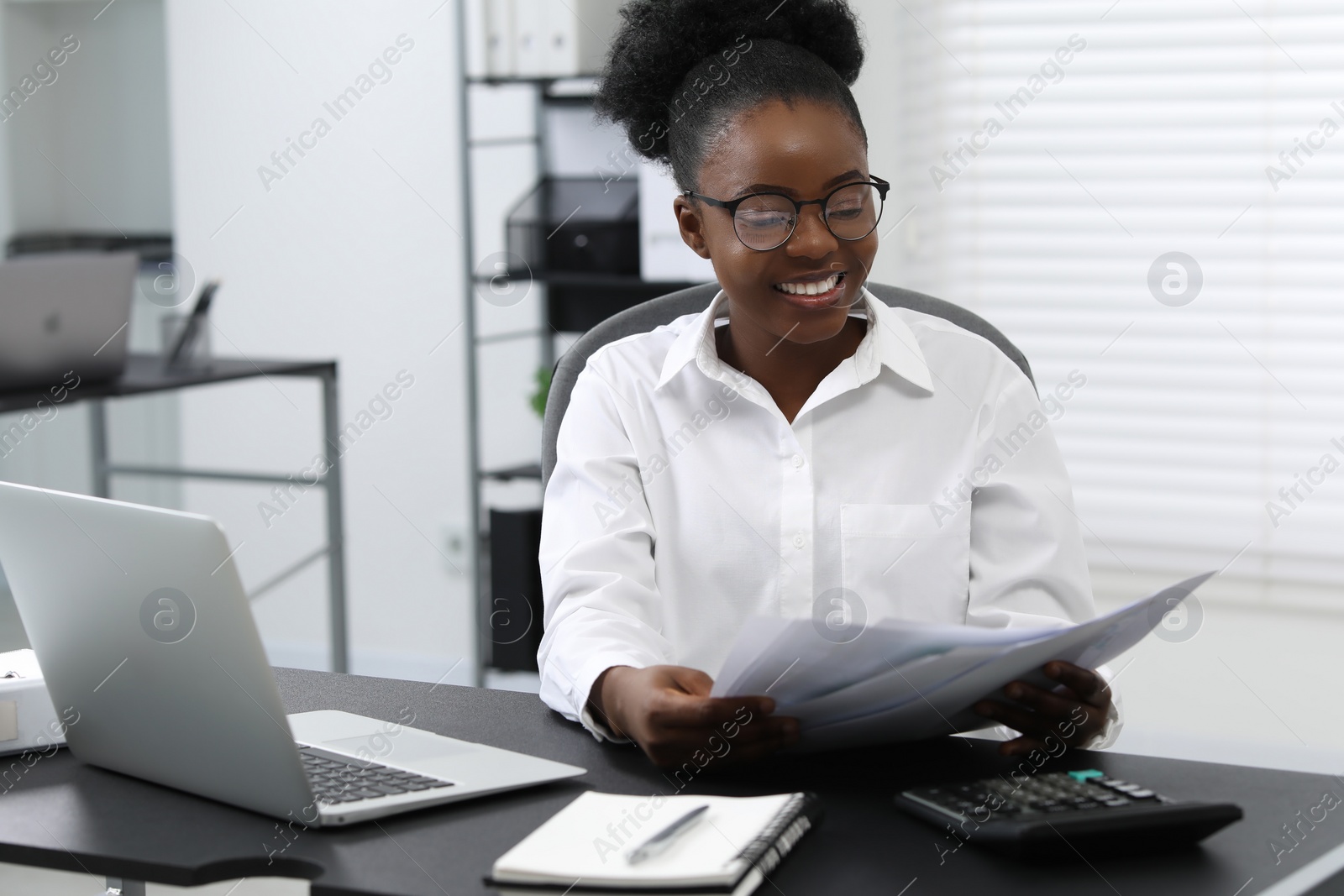 Photo of Professional accountant working at desk in office