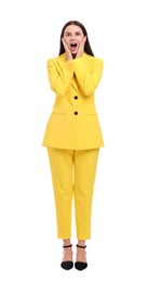 Beautiful businesswoman in yellow suit on white background