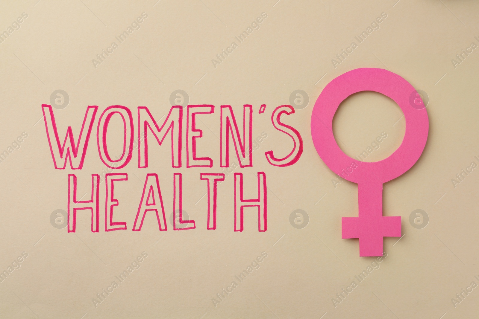 Photo of Female gender sign near text Women's Health on beige background, top view