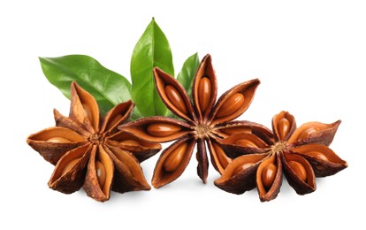 Image of Aromatic dry anise stars and green leaves on white background