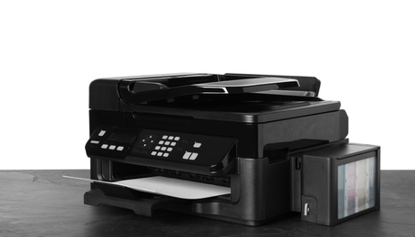 Photo of New modern multifunction printer on grey table
