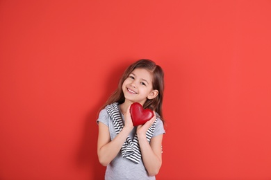 Photo of Portrait of girl with decorative heart on color background