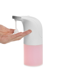 Man using automatic soap dispenser on white background, closeup