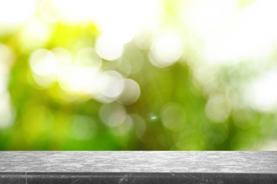 Empty stone surface against blurred background. Bokeh effect