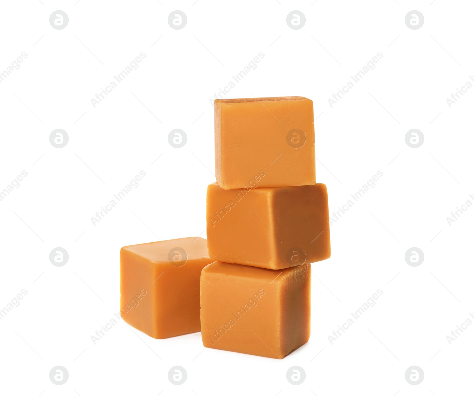 Photo of Heap of caramel candies on white background