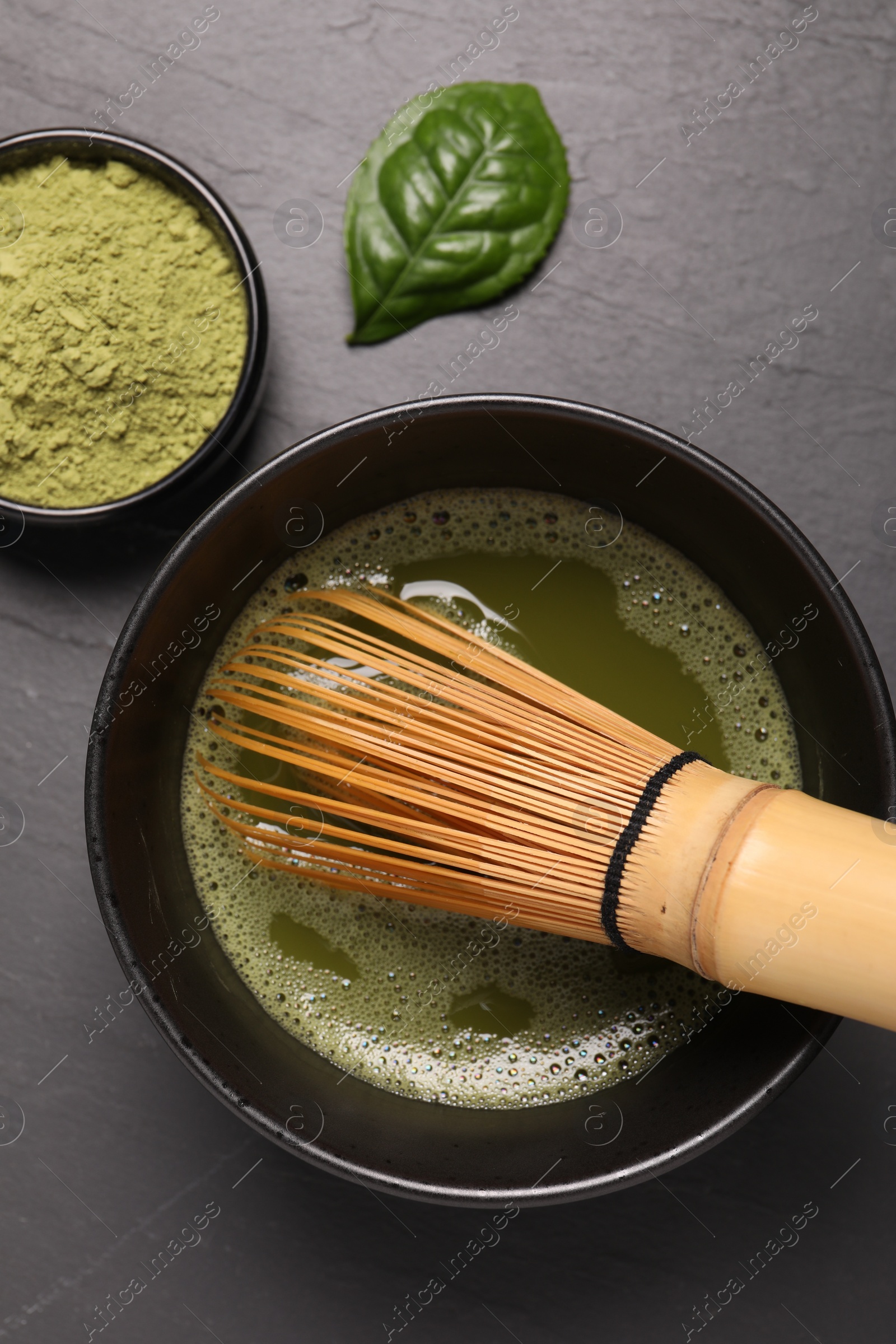 Photo of Flat lay composition with matcha tea on gray table