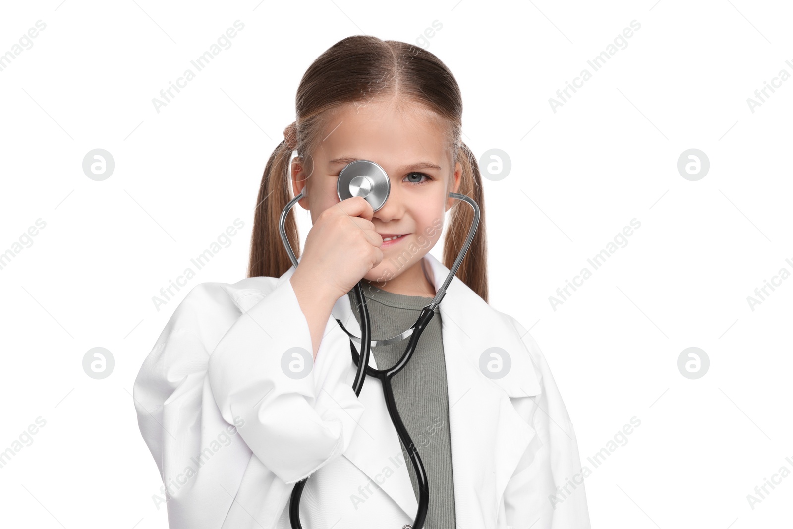 Photo of Little girl in medical uniform with stethoscope on white background